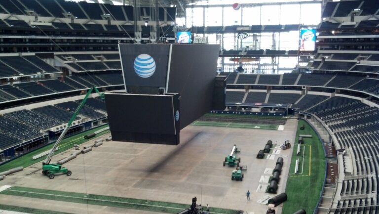 Suspended video display and netting installation inside Dallas Cowboys Stadium